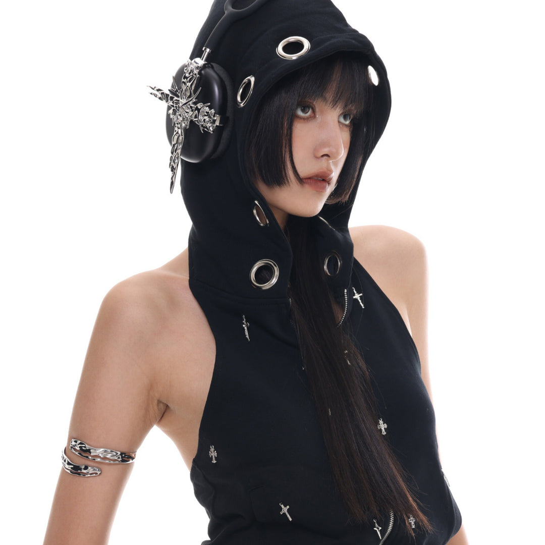 a woman wearing a black hoodie with a hoodie on her head